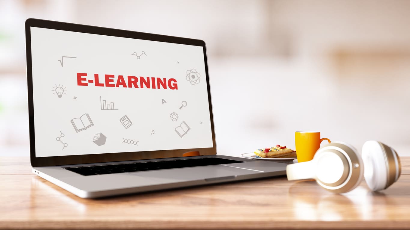 Online Education E-Learning Concept with Laptop and Books